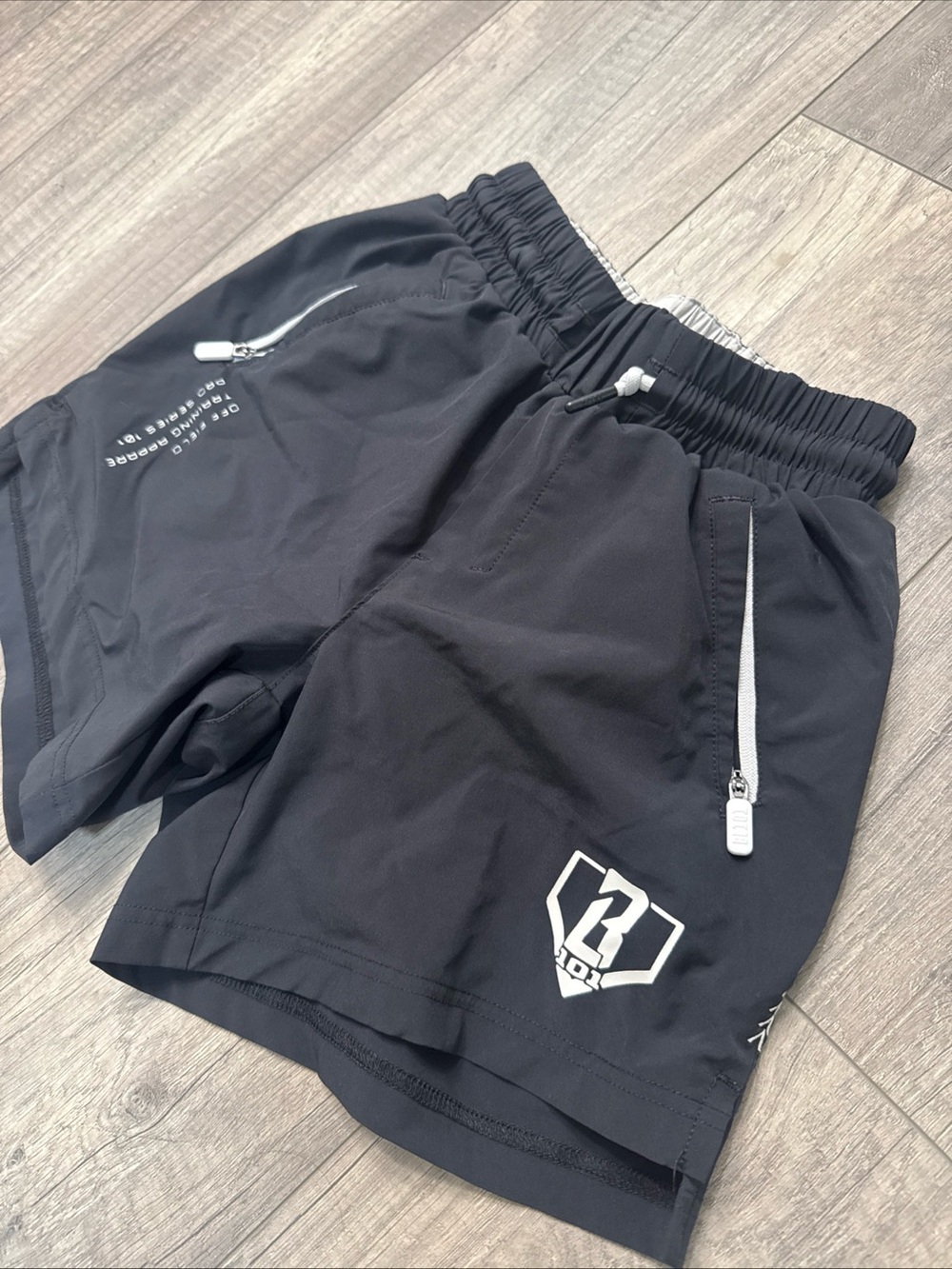 Black Baseball Lifestyle 101 Shorts with White Zip Accents - Picture 2 of 5